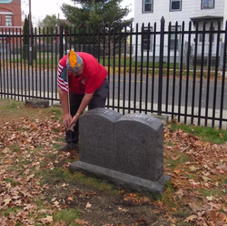 Gene-placing-flagholder-and-flag-at-gravesite-of-3GGF-Nathan-E-Abbott